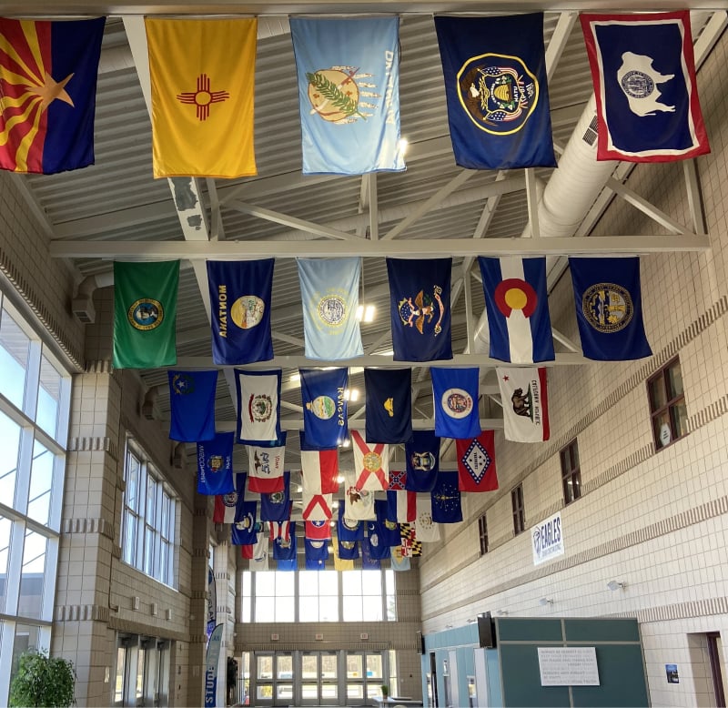 hall way with flags on ceiling
