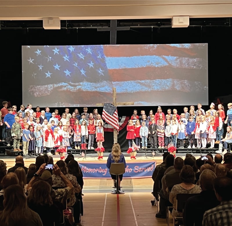 school show with american flag and cross