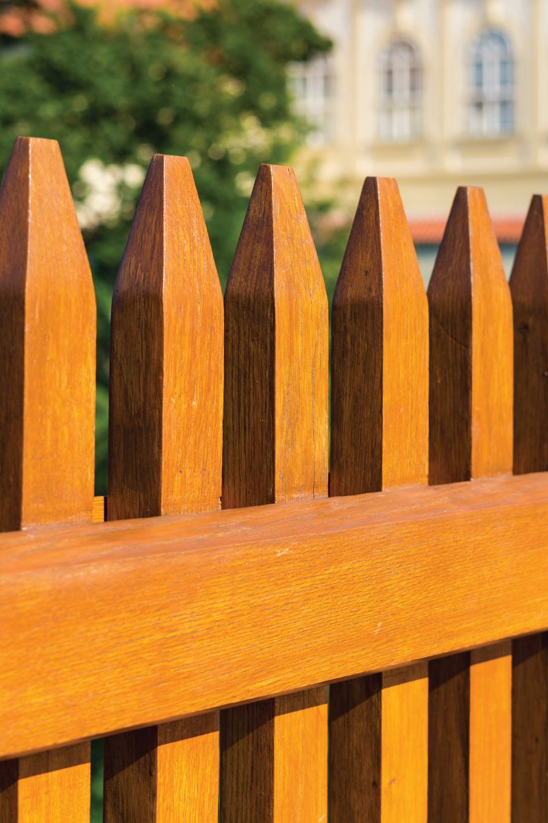 brown stained picket fence