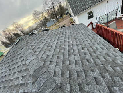 close up of newly installed shingles on a roof