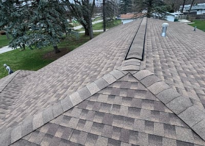 new brown shingles and close up of peak