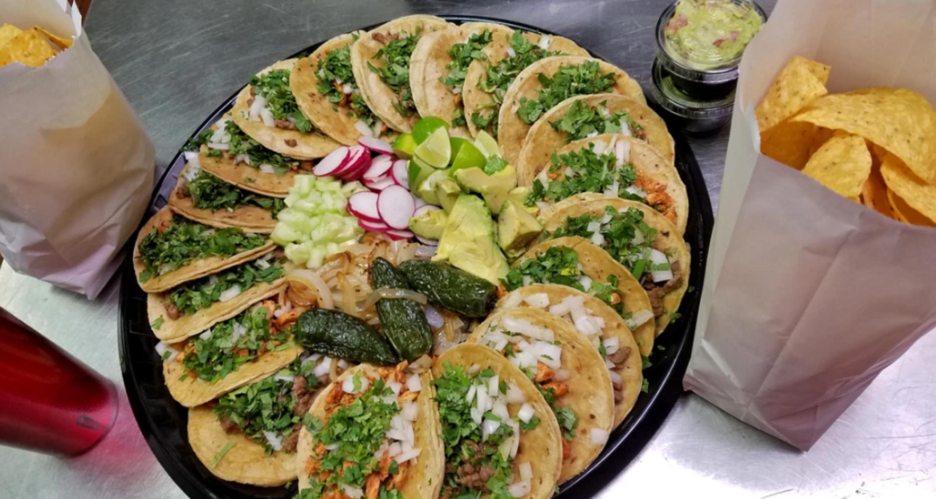 taco platter with greens and toppings